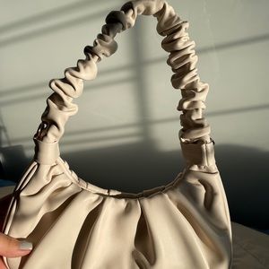 A hand bag/ cross body bag